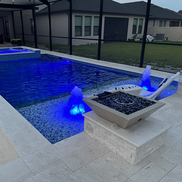 New pool in the backyard with LED lights in Lithia, FL