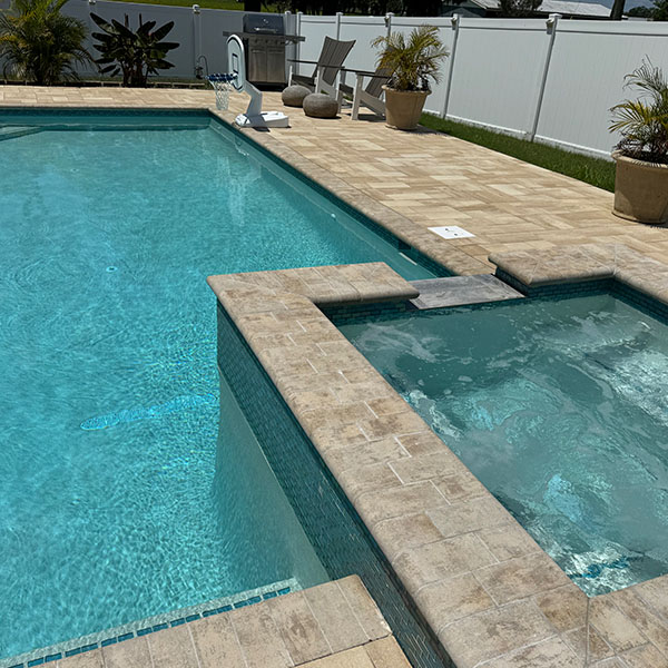 New pool in the backyard with a hot tub in Lithia, FL