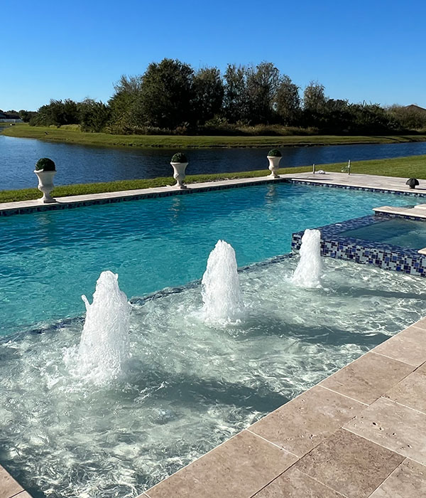 New pool in the backyard with water features in Lithia, FL