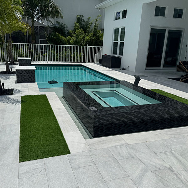 New pool in the backyard with a hot tub in Lithia, FL